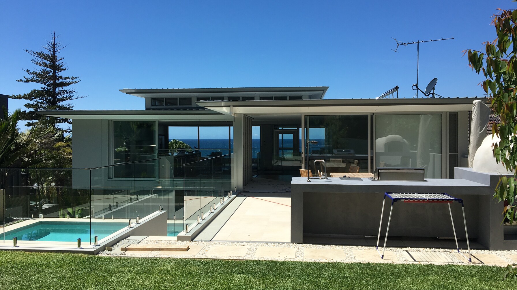 Frameless glass pool fence at a coastal Whale Beach home